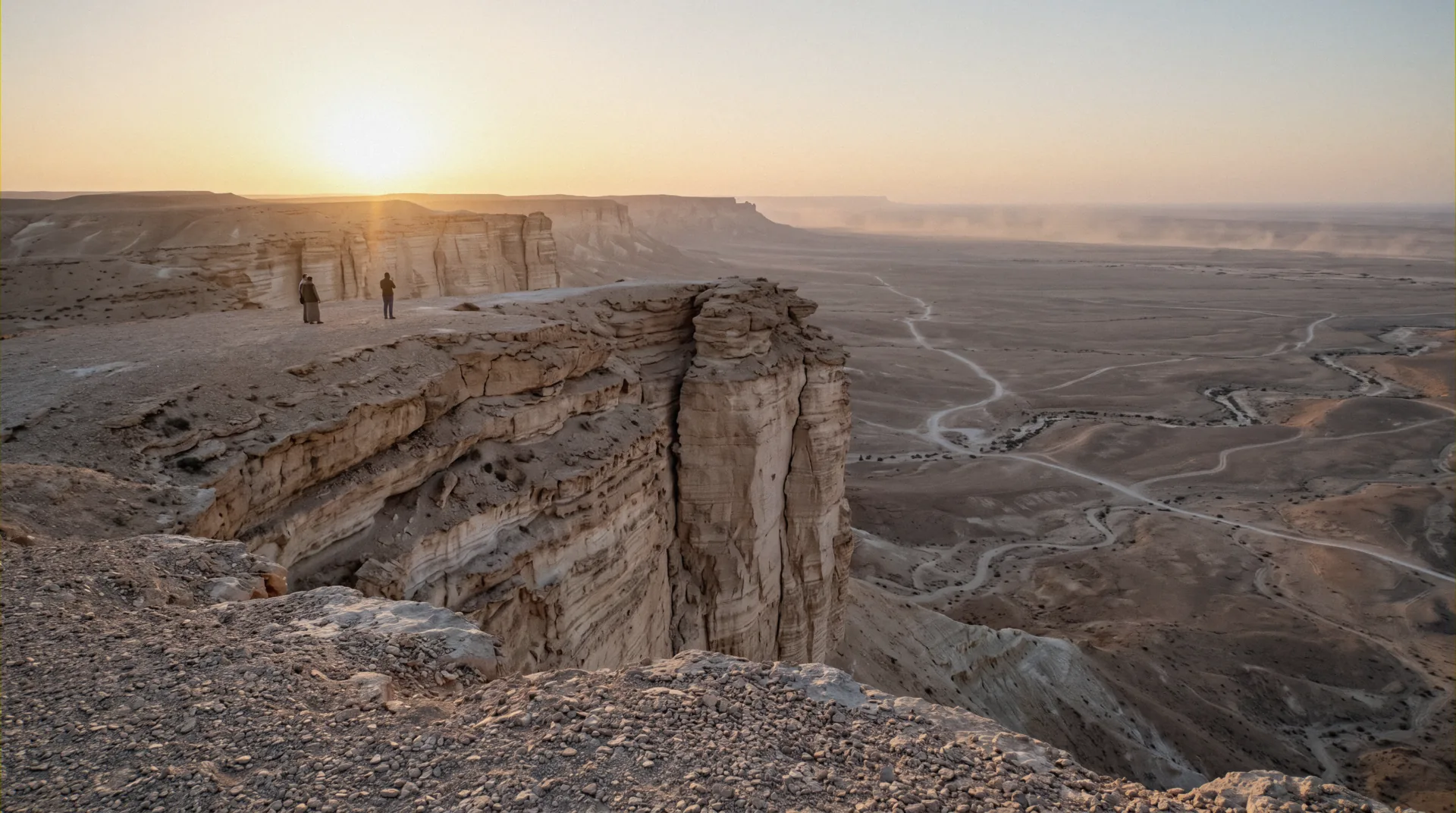 The escarpment at the Edge of the World near Riyadh glowing orange in cool-season evening light, the best time of year to visit