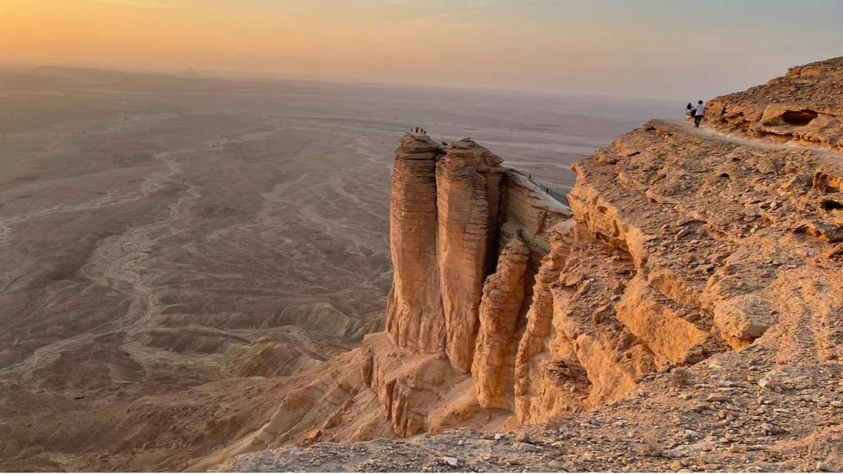 Sunset light on the Jebel Fihrayn cliff face on an Edge of the World Riyadh tour by 4x4, Saudi Arabia